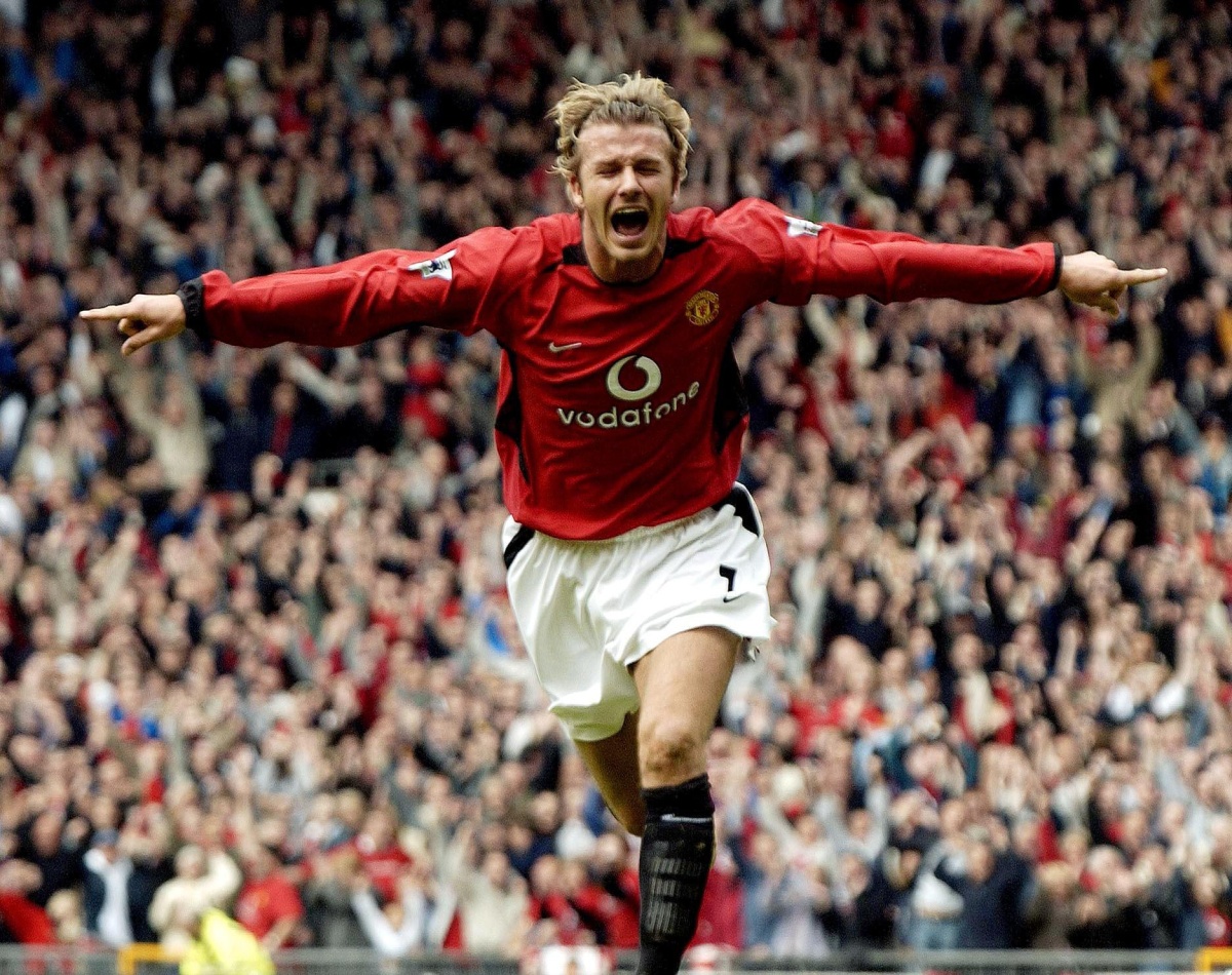 (FILES) In a file picture taken on May 3, 2003 David Beckham celebrates after making it Manchester United 1-Charlton 0 during their English Premier League football match at Old Trafford, in Manchester. David Beckham is to retire from professional football at the end of the season, his representative announced on on May 16, 2013. The 38-year-old midfielder has played for Manchester United, Real Madrid and AC Milan, as well as winning 115 caps for England, and recently won the French Ligue 1 championship with Paris Saint-Germain. AFP PHOTO / PAUL BARKERPAUL BARKER/AFP/Getty Images